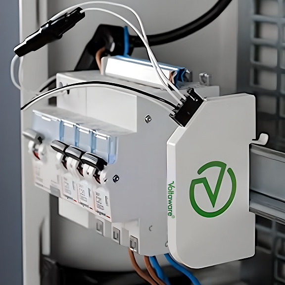 Installer attaching magnetic voltage probes to the breaker; clamp on mains cable - no rewiring.